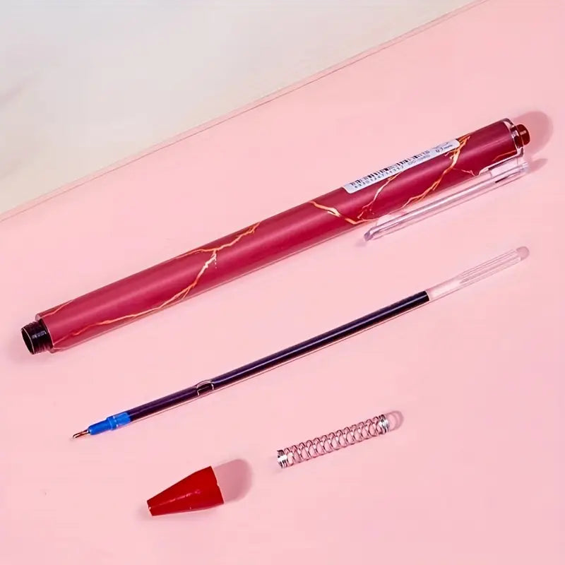 0,7 mm mėlyni geliniai rašikliai su auksine tekstūruota korpuso danga, skirti mokymuisi ir biuro darbui.