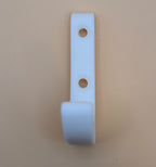 Prie sienos tvirtinamas kabliukas – tvirtas ir paprastas