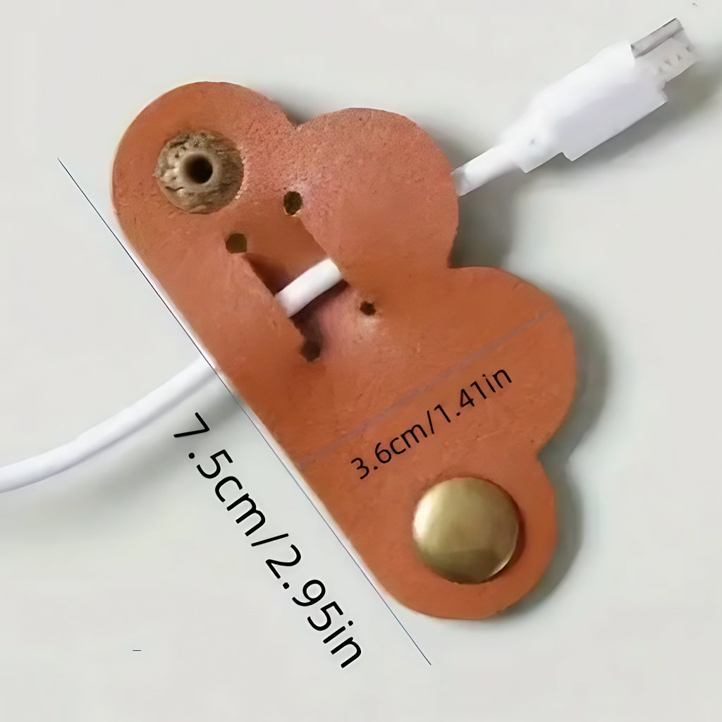 Heart-shaped cable organizer with measurements on a white background